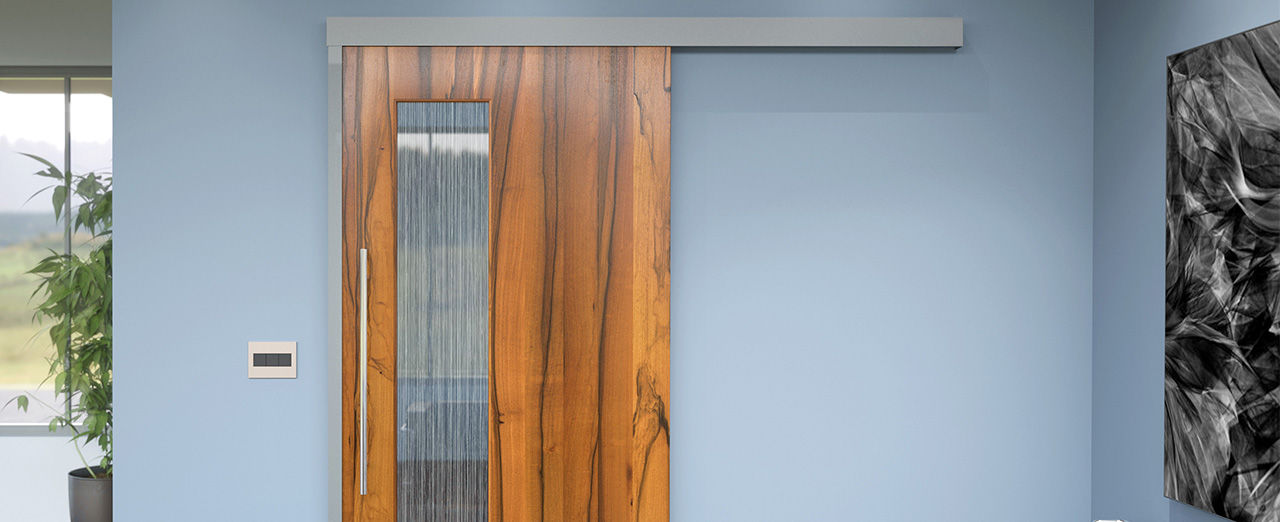 Commercial sliding door with a wooden finish and full-lite glass panel, designed to improve healthcare interior design.