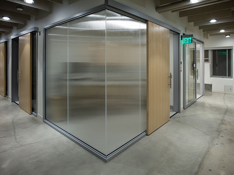  OfficeSlide wooden sliding doors installed on meeting rooms to protect privacy and save space.