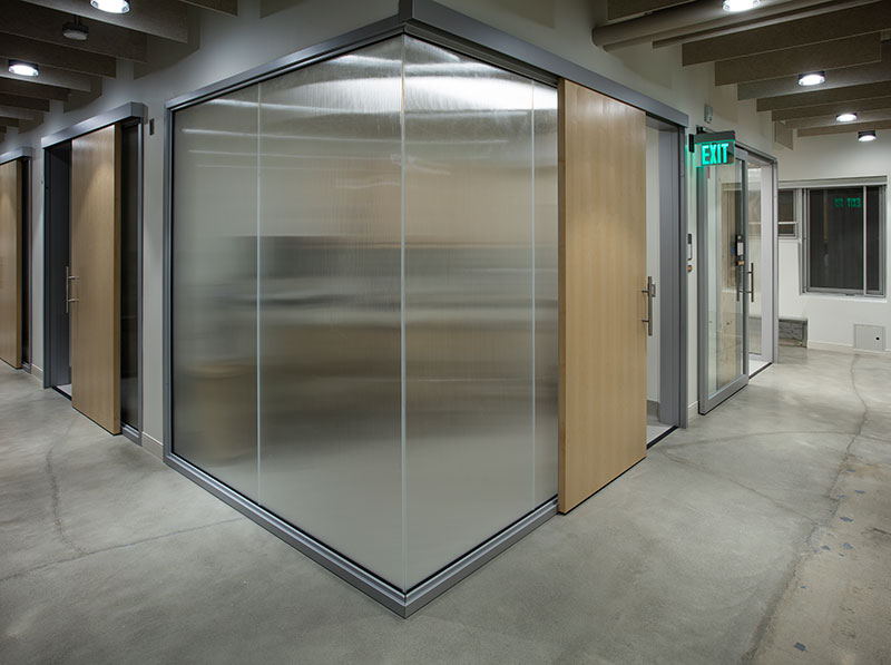 OfficeSlide wooden sliding doors installed on meeting rooms to protect privacy and save space.
